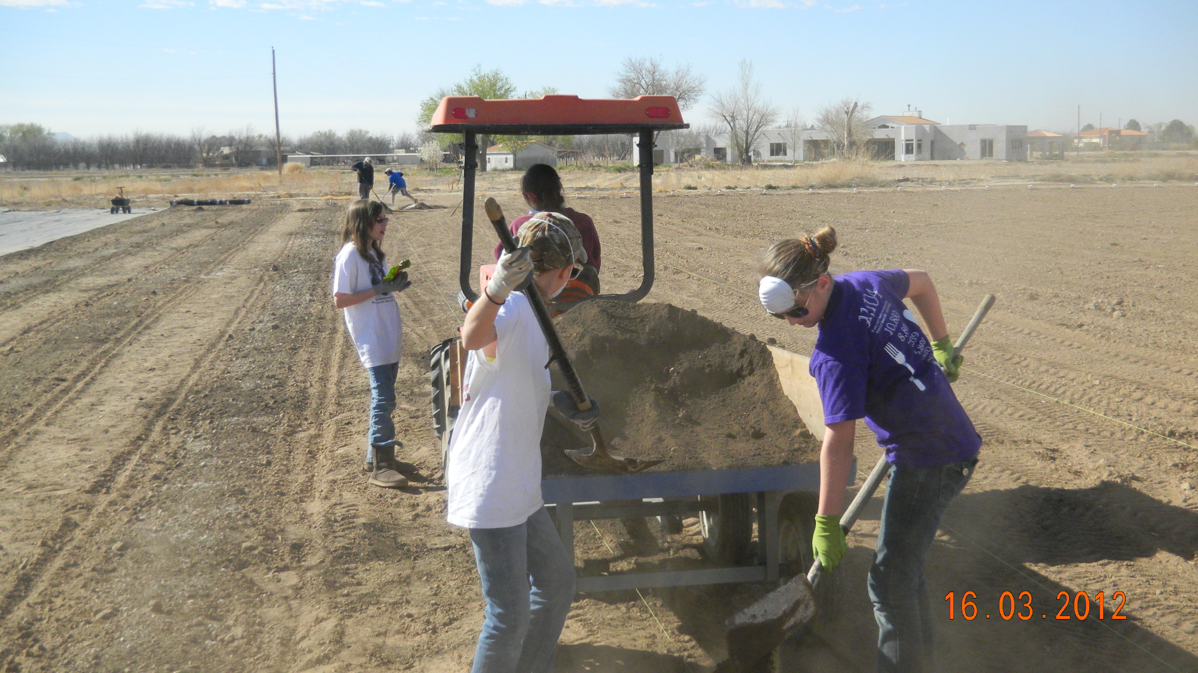 Youth Spreading Compost